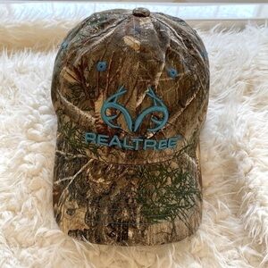 Women's Realtree Baseball Cap Camo with teal trim.